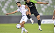 Mohammadhossein Kanani (R) of Al Ahli SC and Ali Iyad Olwan (L) of Al Shamal SC battle for...