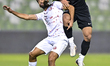 Mohammadhossein Kanani (R) of Al Ahli SC and Ali Iyad Olwan (L) of Al Shamal SC battle for...
