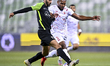 Yazan Abdallah Alnaimat (L)  of Al Ahli SC and Landre Loick (R) of Al Shamal SC battle for...