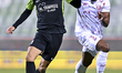 Yazan Abdallah Alnaimat (L)  of Al Ahli SC and Landre Loick (R) of Al Shamal SC battle for...