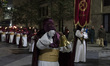 A brother with a bell marks the passage of the nocturnal procession known as the Processio...