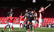 Barrows Josh Gordon fouls Crewes Luke Offord in the area during the Sky Bet League 2 match...