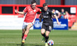 Barrows Robbie Gotts battles with Crewes Connor O'Riordan during the Sky Bet League 2 matc...