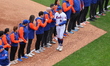 The New York Mets players, coaches and medical staff are introduced in a pre-game ceremony...