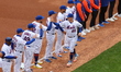 The New York Mets players, coaches and medical staff are introduced in a pre-game ceremony...