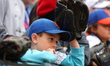 A New York Mets fan hope for a baseball during batting practice before the baseball game b...