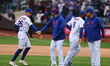 The New York Mets celebrate after their 9-3 win against the Miami Marlins at Citi Field in...