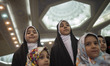 Veiled Iranian schoolgirls perform a religious song during the International holy Koran fa...