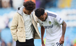 Tyler Adams of Leeds United consoles fellow USMNT teammate Weston McKennie of Leeds United...