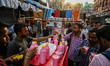 People drink fruit juice from a roadside juice stall, during the Islamic holy month of Ram...