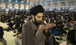 An Iranian cleric prays at the Imam Khomeini Grand mosque in downtown Tehran during the se...