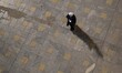 An Iranian cleric walks along the Imam Khomeini Grand mosque in downtown Tehran before the...