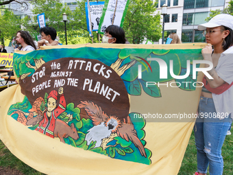 Climate change demonstrators stage a "World Bank Action Day: Ajay Banga, Get Out Of Fossil Fuels!" protest outside of the 2023 IMF-World Ban...