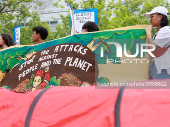 Climate change demonstrators stage a "World Bank Action Day: Ajay Banga, Get Out Of Fossil Fuels!" protest outside of the 2023 IMF-World Ban...