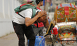 A man splashes water on his head to get relief during a heatwave in Dhaka, Bangladesh on A...