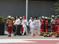 Members of the Mexican Red Cross evacuate a building during the First National Drill 2023 in Mexico, on april 19, 2023, where they carried o...