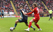 Kieran Sadlier of Leyton Orient battles for possession with Joel Tabiner of Crewe Alexandr...