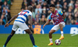 Ian Maatsen #29 of Burnley F.C challenged by Albert Adomah #37 of Queens Park Rangers duri...