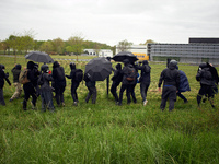 Balck blocs try to destroy the fences arounf a building of Pierre Fabre Industries. More than 8000 protesters marched 12km against the plann...