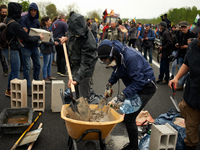 Protesters buid a wall on the N126 during the protest. More than 8000 protesters marched 12km against the planned A69 highway. The collectiv...