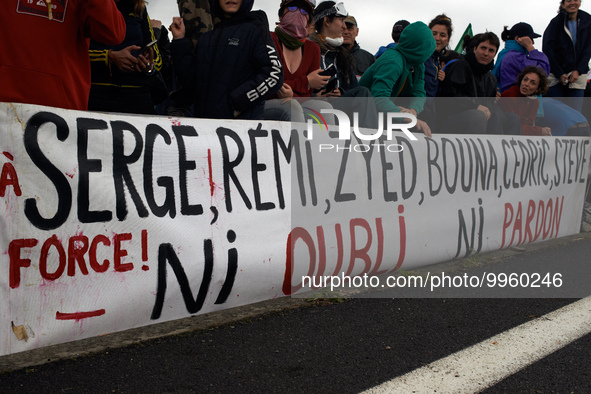 A banner reads 'To Serge, Remi, Zyed, Bouna, Cedric, Steve, no forgetting no forgiveness'.   More than 8000 protesters marched 12km against...
