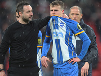 Brighton & Hove Albion manager Roberto De Zerbi console Brighton & Hove Albion's Solly March breaks down in tears after missing crucial pena...