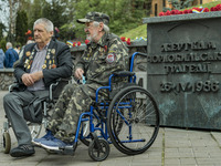 A couple of veteran workers of the Chernobyl NPP  in the memorial in Kyiv about the accident during the celebrations of the 37th anniversary...