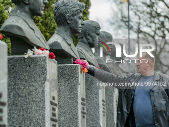 A man lays flowers in the memorial of the dead Chernobyl workers during the celebrations in Kiev of the 37th anniversary of the Chernobyl  n...