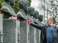 A man lays flowers in the memorial of the dead Chernobyl workers during the celebrations in Kiev of the 37th anniversary of the Chernobyl  n...