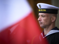 A member of the Polish Navy is seen with a Polish flag at the Palace on the Isle in Warsaw, Poland on 26 April, 2023. The Bucharest Nine is...