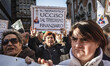 Protesters shout slogans and hold banners comparing the banks to Islamic State and attacki...