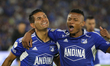 David Silva and Oscar Cortes of Millonarios celebrate the goal during the match against Am...