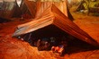Indian Hindu  devotee sleeping in a temporary shade on the sea shore at the Gangasagar Isl...