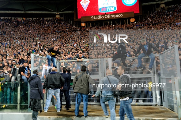 Police speak with SSC Napoli fans before the TIM Cup final match between ACF Fiorentina and SSC Napoli at Olimpico Stadium on May 3, 2014 in...