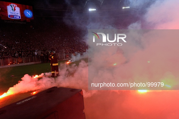 SSC Napoli fans throw flares before the TIM Cup final match between ACF Fiorentina and SSC Napoli at Olimpico Stadium on May 3, 2014 in Rome...