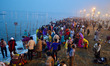 Indian Hindu devotees take a holy dip for the Makar Sankranti festival during the annual "...