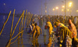 Indian Hindu devotees take a holy dip for the Makar Sankranti festival during the annual "...